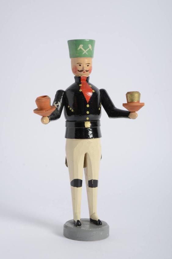 Bergmann als Kerzenhalter